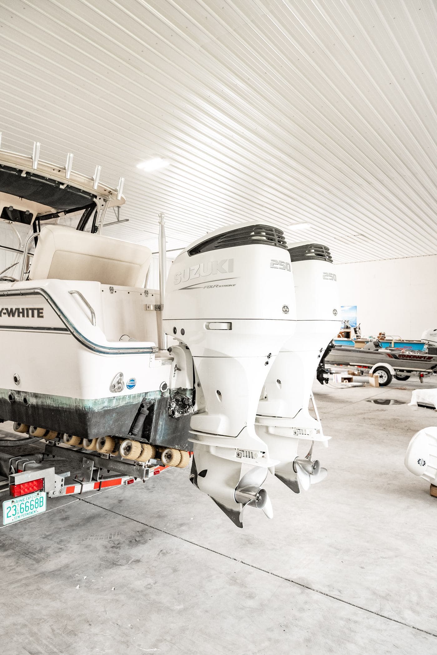 Several customer boats parked inside the Delmarva Service Center shop bay